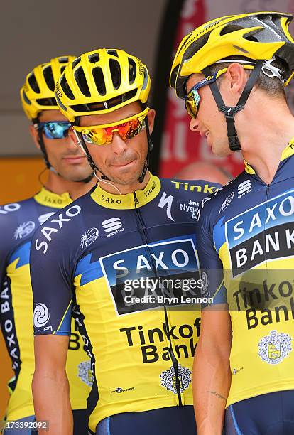 Alberto Contador of Spain and Team Saxo-Tinkoff chats with team-mate Nicolas Roche of Ireland ahead of stage fourteen of the 2013 Tour de France, a...