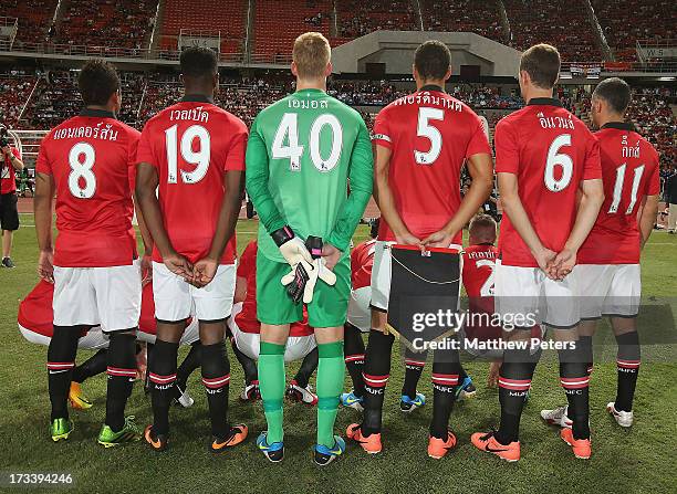 The Manchester United team line up with their names written in Thai ahead of the match between Singha All Star XI and Manchester United at...