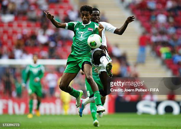 Michael Anaba of Ghana and Jawad Kadhim of Iraq compete for the ball during the FIFA U-20 World Cup 3rd Place playoff match between Ghana and Iraq at...
