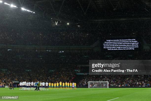 Players, fans and match officials observe a minutes silence in remembrance of the victims of last weekends attacks in Israel prior to the...
