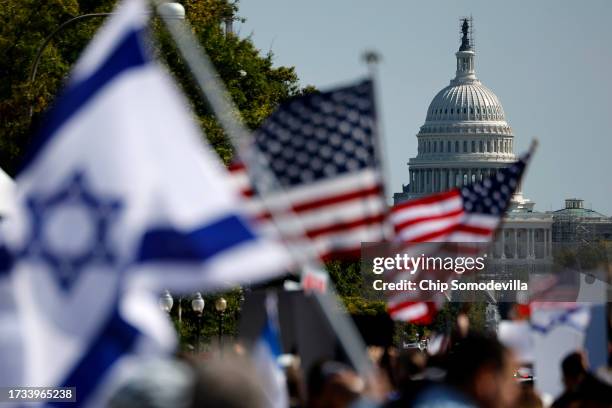People gather for a 'Stand With Israel Rally' in Freedom Plaza on October 13, 2023 in Washington, DC. Organized by the Jewish Community Relations...