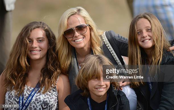 Amy Mickelson poses with children Evan, Amanda and Sophia during the third round of the Aberdeen Asset Management Scottish Open at Castle Stuart Golf...
