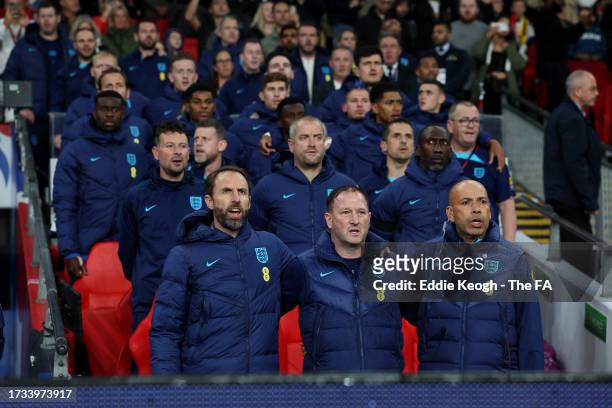 Gareth Southgate, Manager of England men's senior team, Steve Holland and Paul Nevin sing the national anthem prior to the international friendly...
