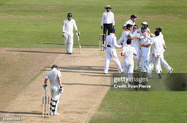 Graeme Swann of England celebrates after taking the wicket of Steve Smith of Australia during day four of the 1st Investec Ashes Test match between...