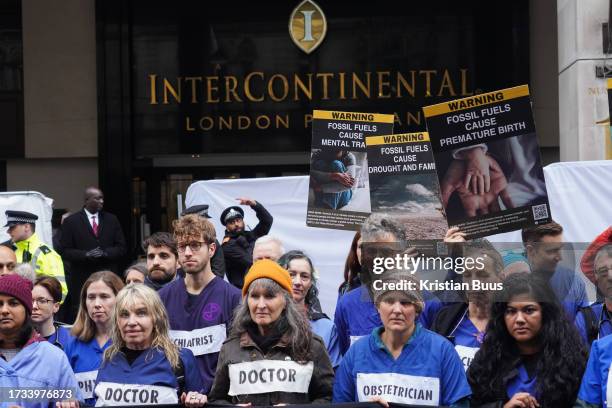 Health professionals from Health for Extinction Rebellion outside the Energy Intelligence forum at the Hotel InterContinental on the 19th October...