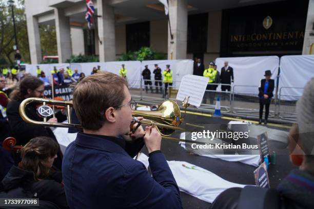 Health professionals from Health for Extinction Rebellion stage a die-in outside the Energy Intelligence forum at the Hotel InterContinental on the...