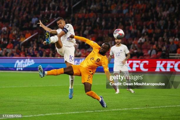 Kylian Mbappe of France scores the team's first goal past Lutsharel Geertruida of Netherlands during the UEFA EURO 2024 European qualifier match...