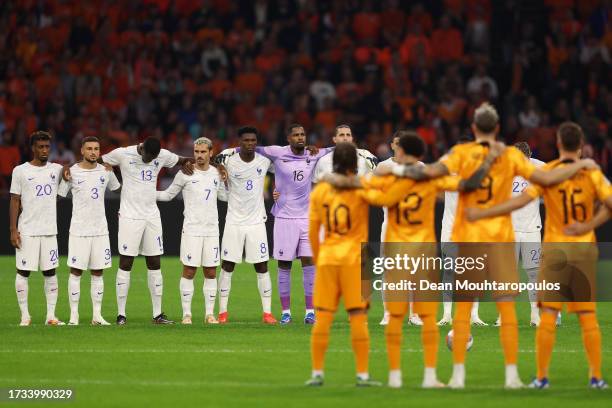 Players, fans and match officials observe a minutes silence in remembrance of the victims of last weekends attacks in Israel prior to the UEFA EURO...