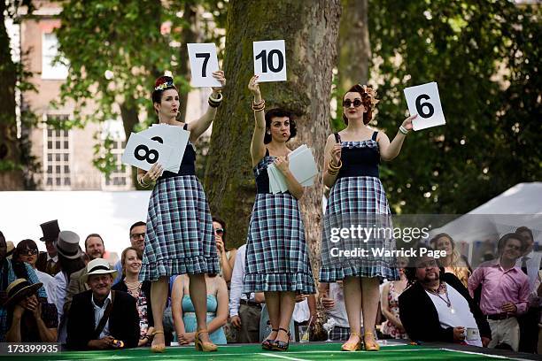 Women rate performances in the Chap Olympiad, an eccentric sporting event held in Bedford Square on July 13, 2013 in London, England. The event has...