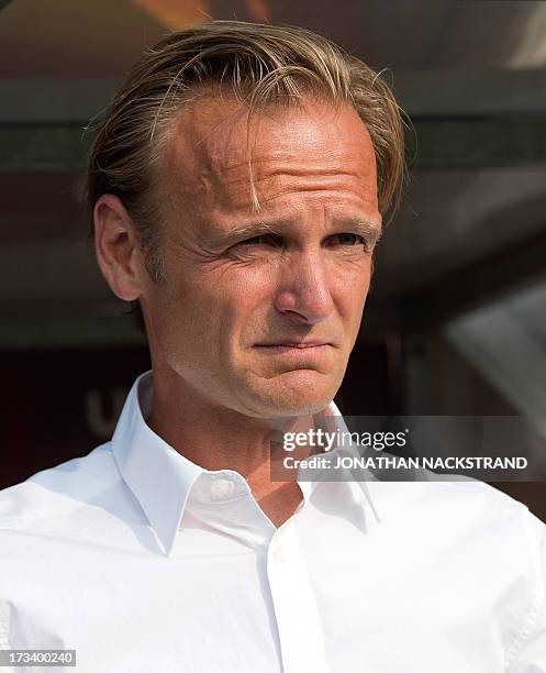 Denmark's head coach Kenneth Heiner-Moller looks on prior to the UEFA Women's European Championship Euro 2013 group A football match Italy vs Denmark...