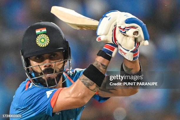 India's Virat Kohli plays a shot during the 2023 ICC Men's Cricket World Cup one-day international match between India and Bangladesh at the...