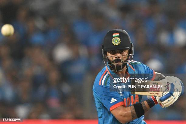 India's Virat Kohli plays a shot during the 2023 ICC Men's Cricket World Cup one-day international match between India and Bangladesh at the...