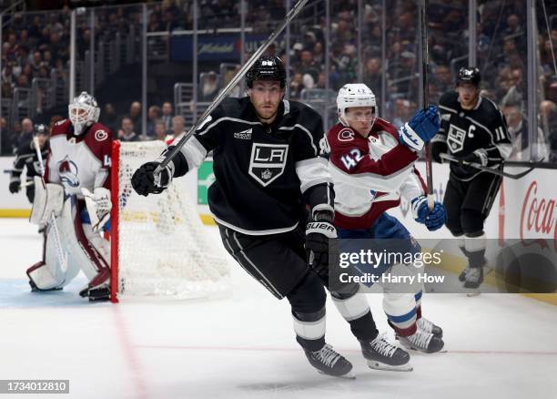 Pierre-Luc Dubois of the Los Angeles Kings skates after the puck with Sergei Boikov of the Colorado Avalanche during a 5-3 loss to the Colorado...