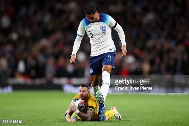 Levi Colwill of England looks on with Martin Boyle of Australia during the international friendly match between England and Australia at Wembley...