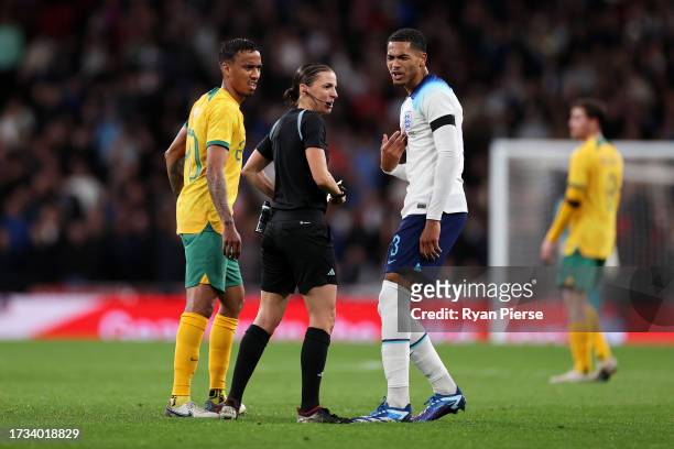 Referee Stephanie Frappart speaks to Levi Colwill of England during the international friendly match between England and Australia at Wembley Stadium...