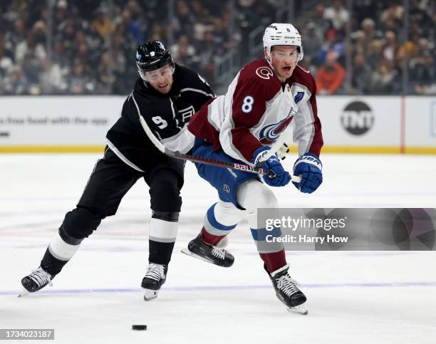 Cale Makar of the Colorado Avalanche reacts as he is hooked by Adrian Kempe of the Los Angeles Kings during the Los Angeles Kings season opening game...