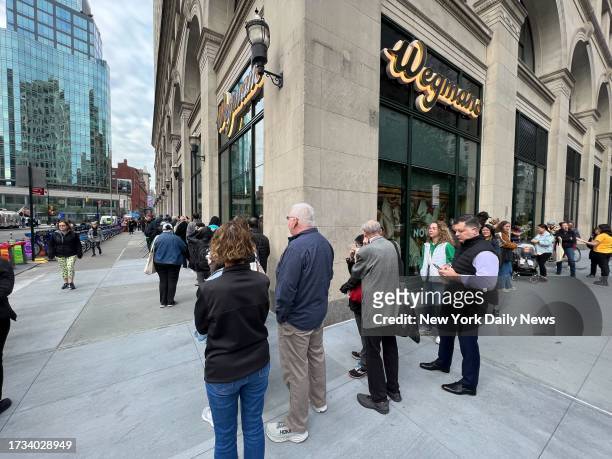 October 18: People line up outside the new Wegmans at Astor Place in Manhattan on Wednesday, Oct. 18, 2023.