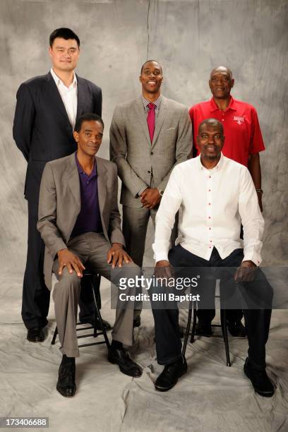 Dwight Howard poses for a photo as the newest Rocket by Rockets center legends Hakeem Olajuwon, Elvin Hays, Ralph Sampson and Yao Ming were in...
