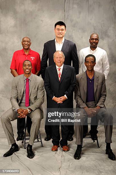 Dwight Howard poses for a photo along with Leslie Alexander owner and the newest Rocket by Rockets center legends Hakeem Olajuwon, Elvin Hays, Ralph...