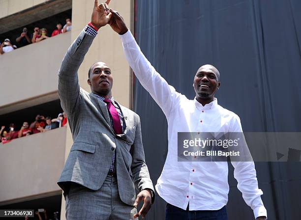 Dwight Howard is introduced as the newest Rocket by Rockets center legend Hakeem Olajuwon to the Rockets on July 13, 2013 at The Toyota Center...