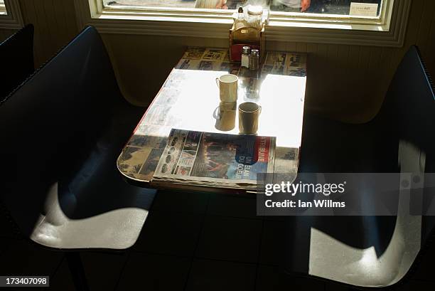 Local newspaper, displaying front page headlines about the recent disaster is seen in a Lac-Megantic diner, July 13, 2013 in Lac-Megantic, Quebec,...