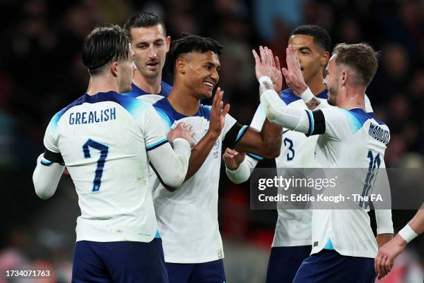 Ollie Watkins of England celebrates with teammates Jack Grealish, Lewis Dunk, Levi Colwill and James Maddison after scoring the team's first goal...