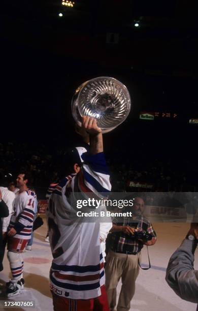Stephane Matteau of the New York Rangers holds the Stanley Cup Trophy after defeating the Vancouver Canucks in Game 7 of the 1994 Stanley Cup Finals...