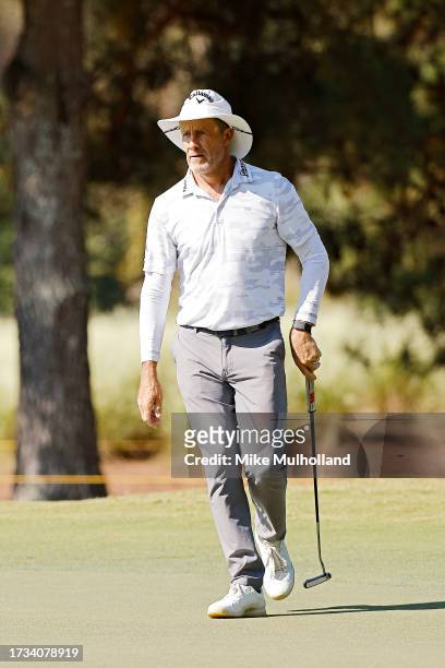 Stuart Appleby of Australia reacts after a putt on the second hole during the first round of the SAS Championship at Prestonwood Country Club on...