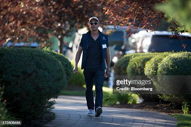 Jeff Bezos, chief executive officer of Amazon.com Inc., walks to a morning session at the Allen & Co. Media and Technology Conference in Sun Valley,...