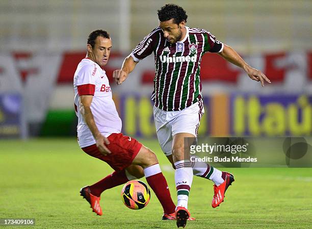 Fred of Fluminense fights for the ball during the match between Fluminense and Internacional a as part of Brazilian Championship 2013 at Moacyrzao...