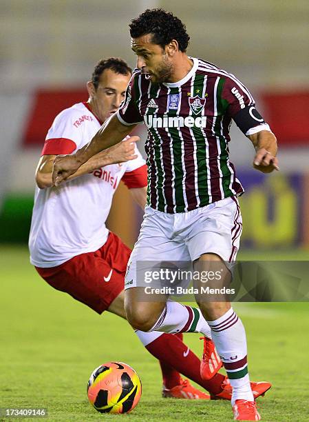 Fred of Fluminense fights for the ball during the match between Fluminense and Internacional a as part of Brazilian Championship 2013 at Moacyrzao...