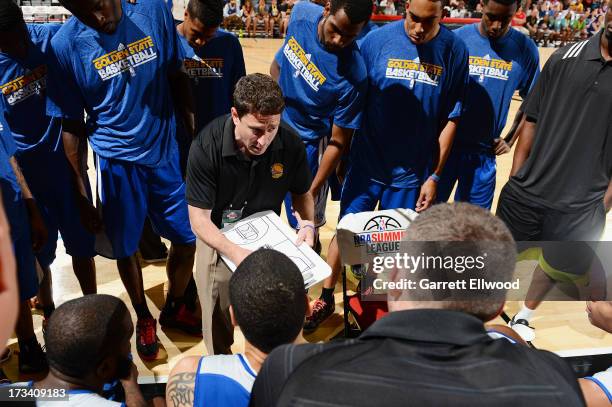 Head Coach Darren Erman of the Golden State Warriors gives direction to his players against the Washington Wizards during NBA Summer League on July...