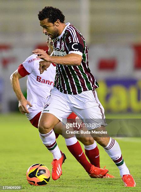 Fred of Fluminense fights for the ball during the match between Fluminense and Internacional a as part of Brazilian Championship 2013 at Moacyrzao...