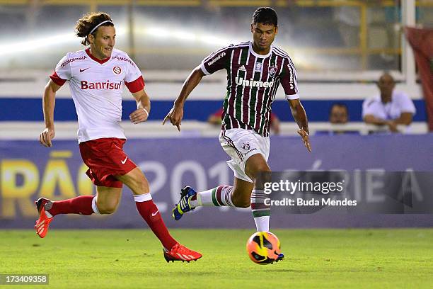 Gum of Fluminense fights for the ball with a Forlan during the match between Fluminense and Internacional a as part of Brazilian Championship 2013 at...