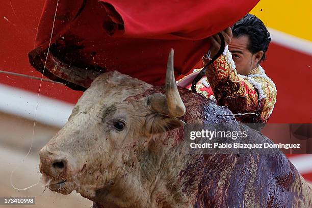 Bullfighter Ivan Fandino performs with a Fuente Ymbro's fighting bull on the eighth day of the San Fermin Running Of The Bulls festival on July 13,...