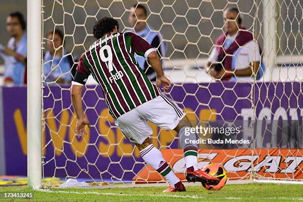 Fred of Fluminense converts a goal during the match between Fluminense and Internacional a as part of Brazilian Championship 2013 at Moacyrzao...
