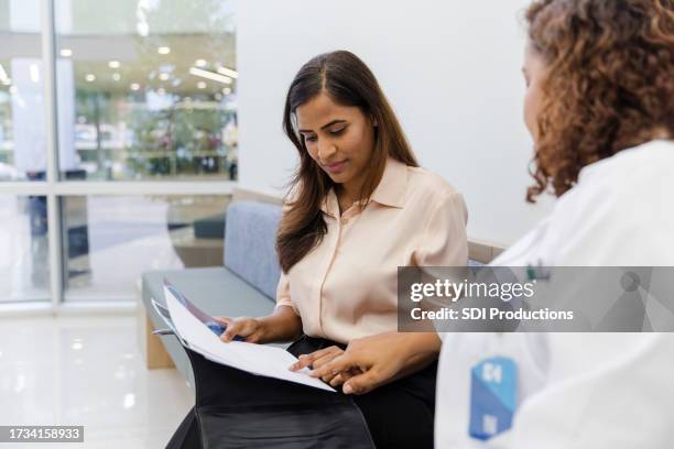 female human resources manager meets with the physician - medisch vertegenwoordiger stockfoto's en -beelden