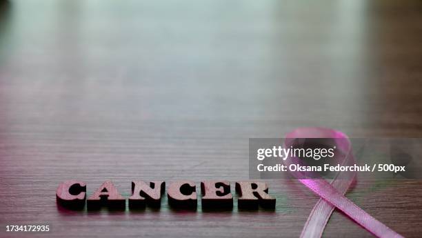 close-up of text on table - world cancer day stock pictures, royalty-free photos & images