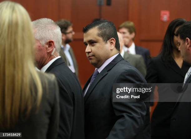 George Zimmerman leaves court with his family after a jury found him not guilty in Seminole circuit court July 13, 2013 in Sanford, Florida....