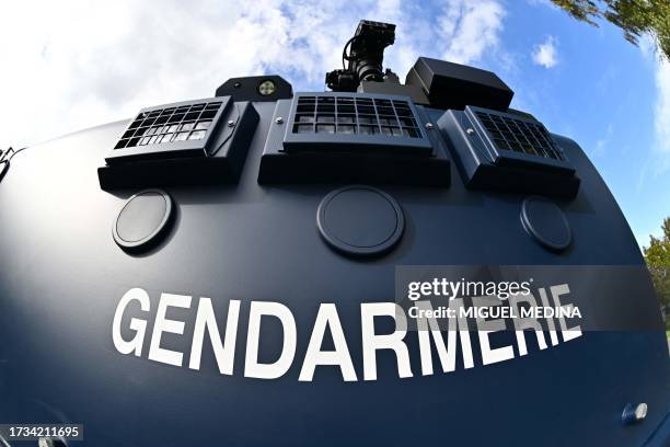 This picture taken with a fisheye lens on October 19, 2023 shows the sign of the Gendarmerie on the side of the Centaure, the new armored vehicle of...