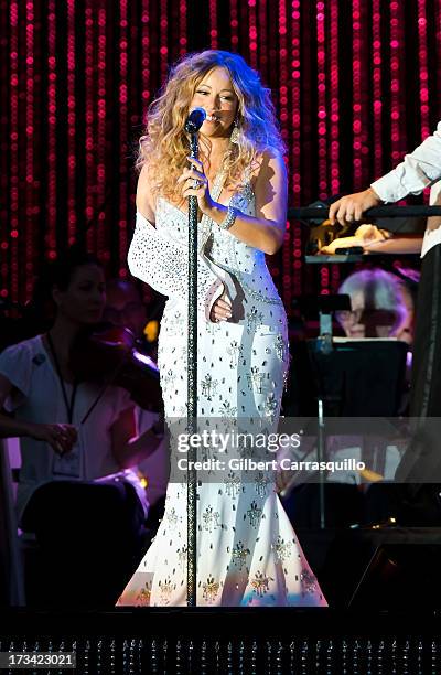 Mariah Carey performs on stage during 2013 Major League Baseball All-Star Charity Concert starring The New York Philharmonic with Special Guest...