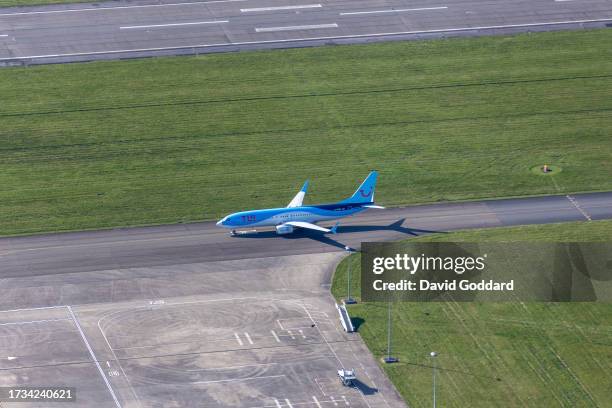 In an aerial view, a Tui Boeing 737 at taxing at Cardiff Airport on October 6,2023 Cardiff, United Kingdom.