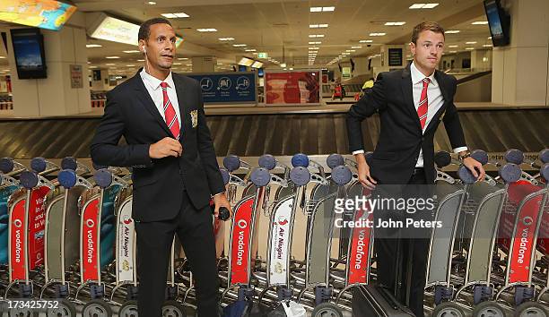 Rio Ferdinand and Jonny Evans of Manchester United arrive at Sydney International Airport as part of their pre-season tour of Bangkok, Australia,...