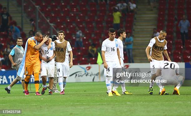 Uruguay players look dejected after beeing defeated by France in their final football match at the FIFA Under 20 World Cup at Turk Telecom stadium in...