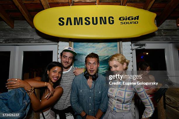 Hannah Bronfman and beau, Brendan Fallis, in the DJ booth showing model, Jessica Stam, the ropes on Samsung's brand new Giga Sound system at Surf...