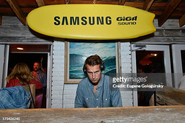 Brendan Fallis performs in the DJ booth during Samsung's Summer DJ Series to launch the Giga Sound System at Surf Lodge on July 13, 2013 in Montauk,...