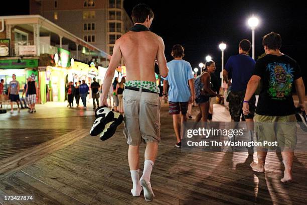 An Ocean City beach patron wears saggy pants while walking with friends on the boardwalk with friends in Ocean City, MD, on July 11, 2013. Ocean City...