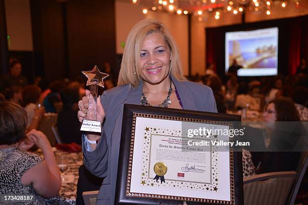 Lydia E. Pizarro attends The 9th Annual Success Summit hosted by Dress For Success Worldwide at Epic Hotel on July 13, 2013 in Miami, Florida.