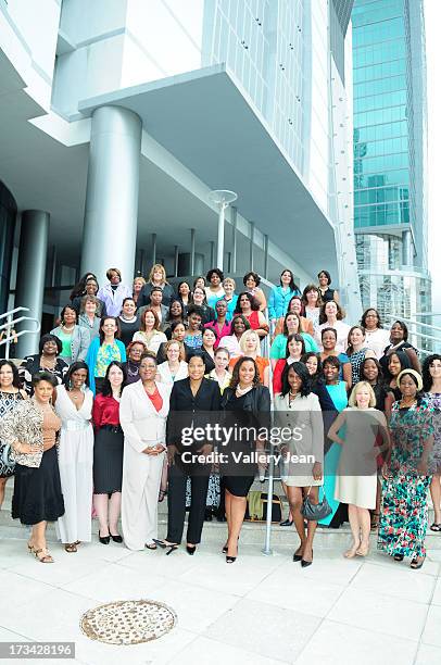 General view of a group portrait of Dress for Success Delegates From Around the World attend The 9th Annual Success Summit hosted by Dress For...