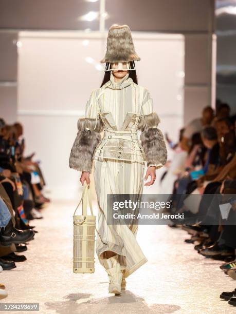 Models walk the runway wearing creations by designer Fengyuan Dai during the fashion show of the 10 finalists of the 38th International Festival Of...